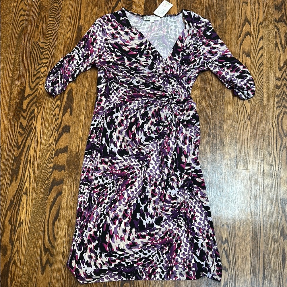 Cleo Black and White Sheath Dress with V-Neck and Cuffed Sleeves